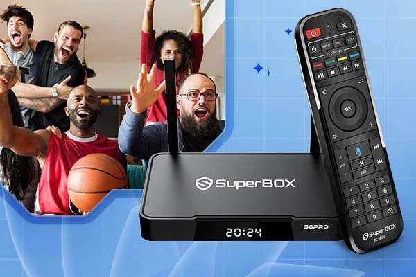 SuperBOX streaming device and remote in the foreground, with a joyful group of friends cheering during a basketball game in the background.