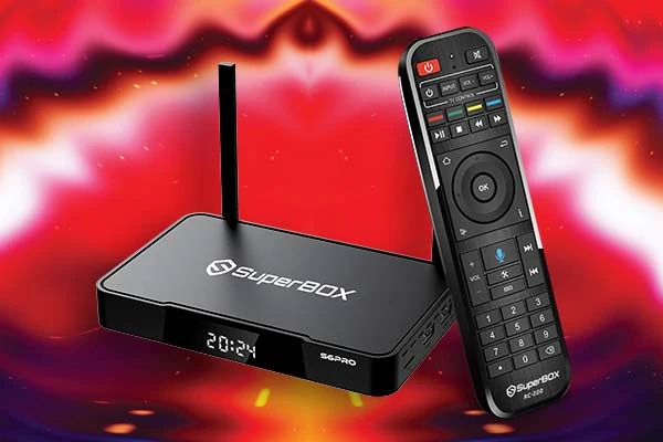 SuperBOX streaming box and remote control against a colorful background, showcasing the device for enhanced home entertainment options.